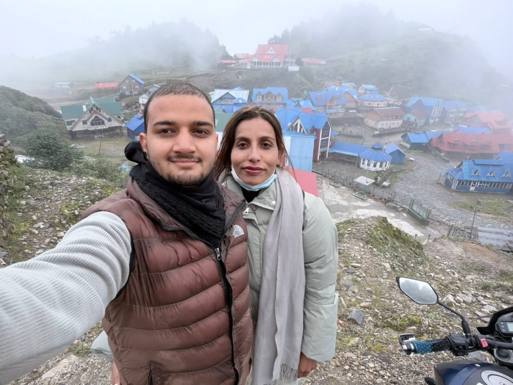 Inside the cable car, inside a cloud. Blue roofs where the mountains should have been.